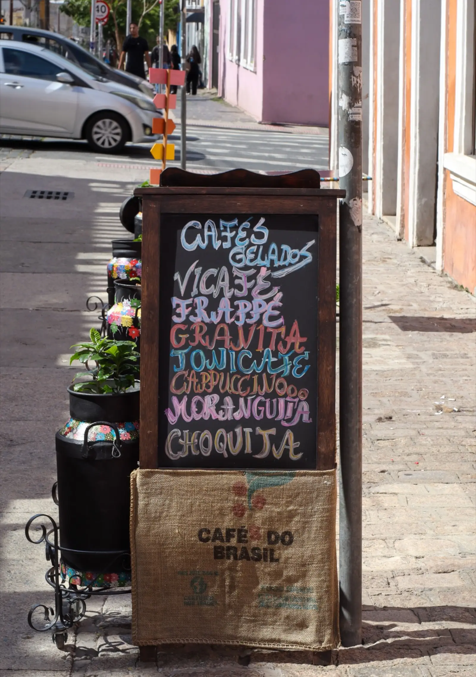 A chalkboard café menu on a street