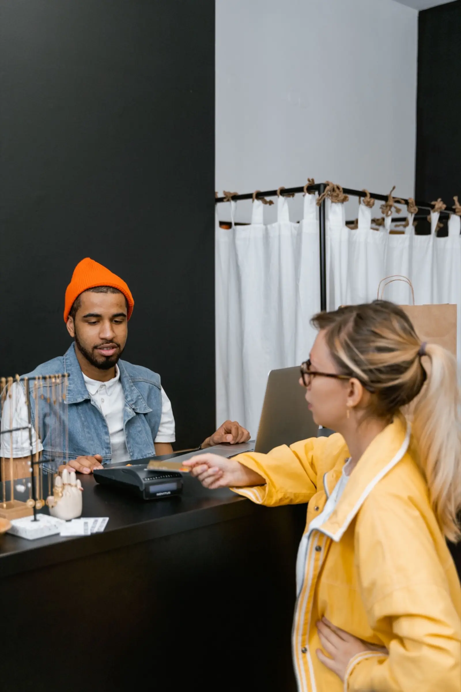 Two people working at a laptop